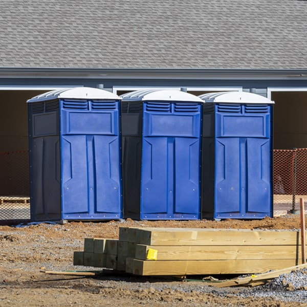 what is the cost difference between standard and deluxe porta potty rentals in Buchanan Michigan